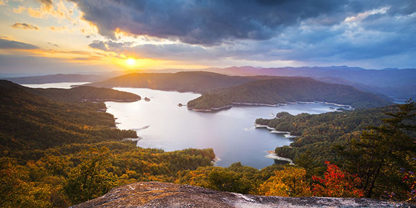 Colorful skies float above a scenic park